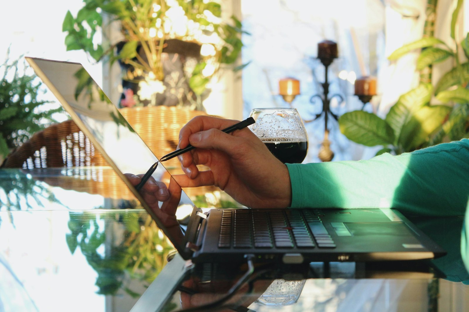 A person looking up answers on a laptop at home